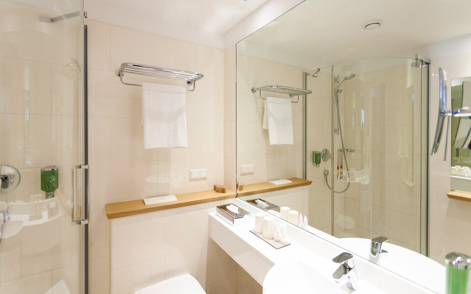 Modern bathroom with shower at city hotel Henriette in Vienna.