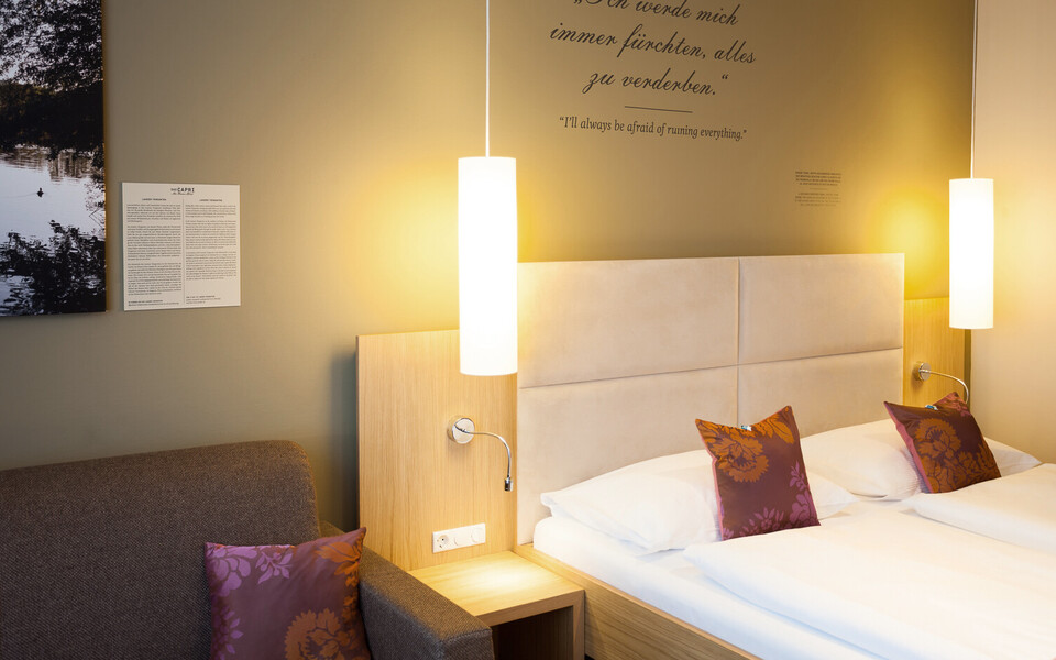 Large double bed in the family room at the city center hotel Henriette in Vienna.