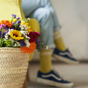 Bouquet of flowers in a wicker basket in a hotel room in the Boutique Hotel Henriette in the center of Vienna.