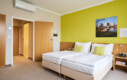 Großzügiges Doppelzimmer mit Balkon im Henriette Stadthotel in Wien.