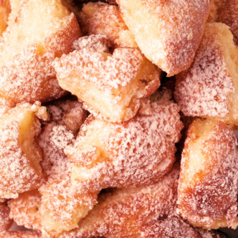 Close-up of Kaiserschmarrn sprinkled with powdered sugar.