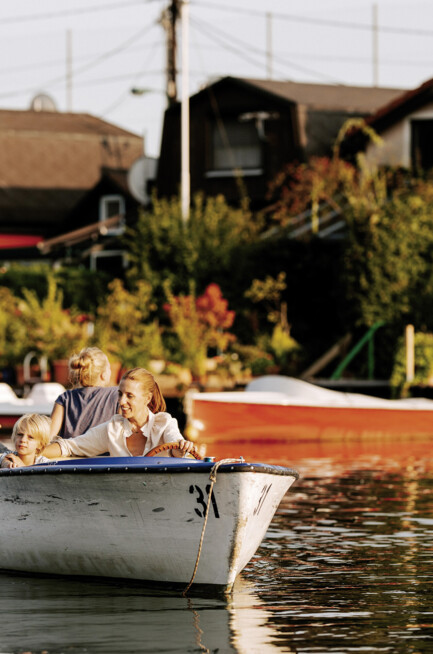 Summer in Vienna: A young family boating on the Old Danube, just five metro stops from Hotel Henriette.