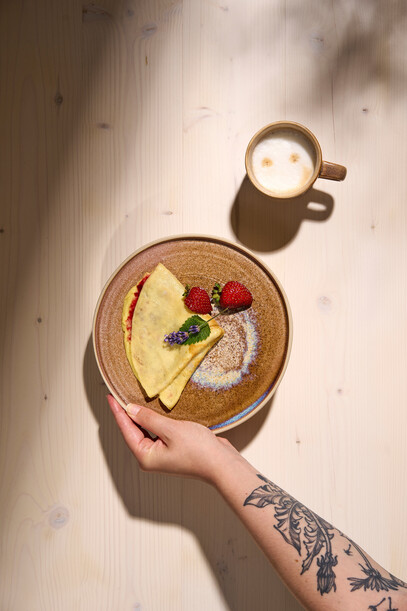 Fresh pancakes with fruit and coffee - breakfast at Hotel Henriette, Vienna