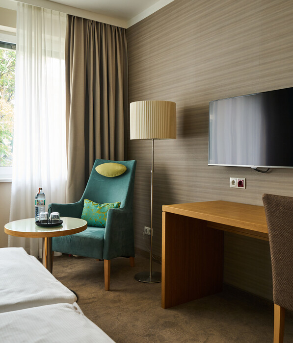 Superior Double Room with seating area at Henriette Stadthotel in the centre of Vienna.