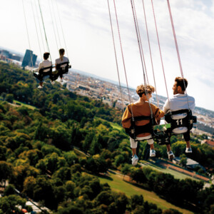 Couples on the chair swing in Vienna's Prater.