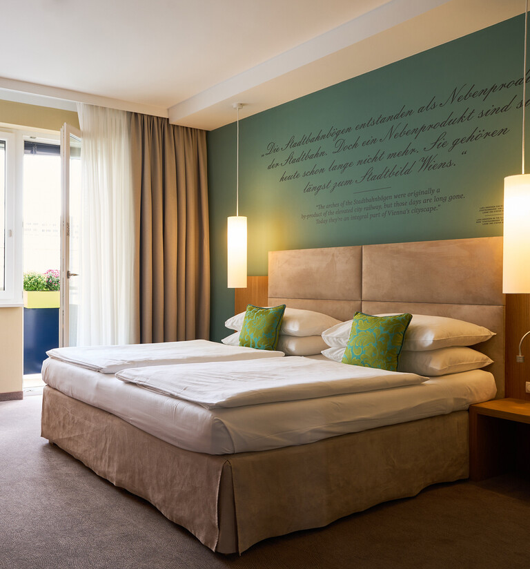 Spacious Double Room with Balcony at Stadt Hotel Henriette – Your Hotel with Chemical-Free Room Cleaning
