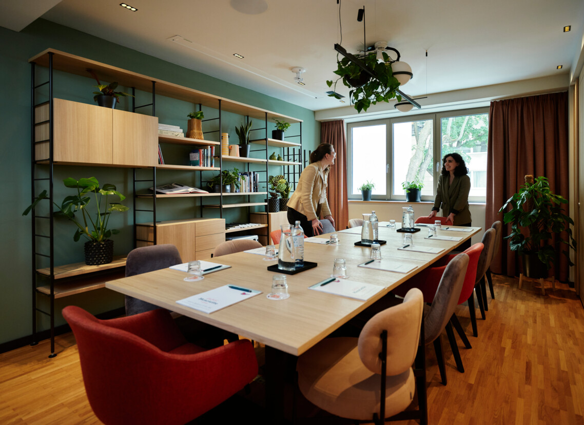 The seminar team at Hotel Henriette preparing the ‘Library’ seminar room for your meeting in Vienna.