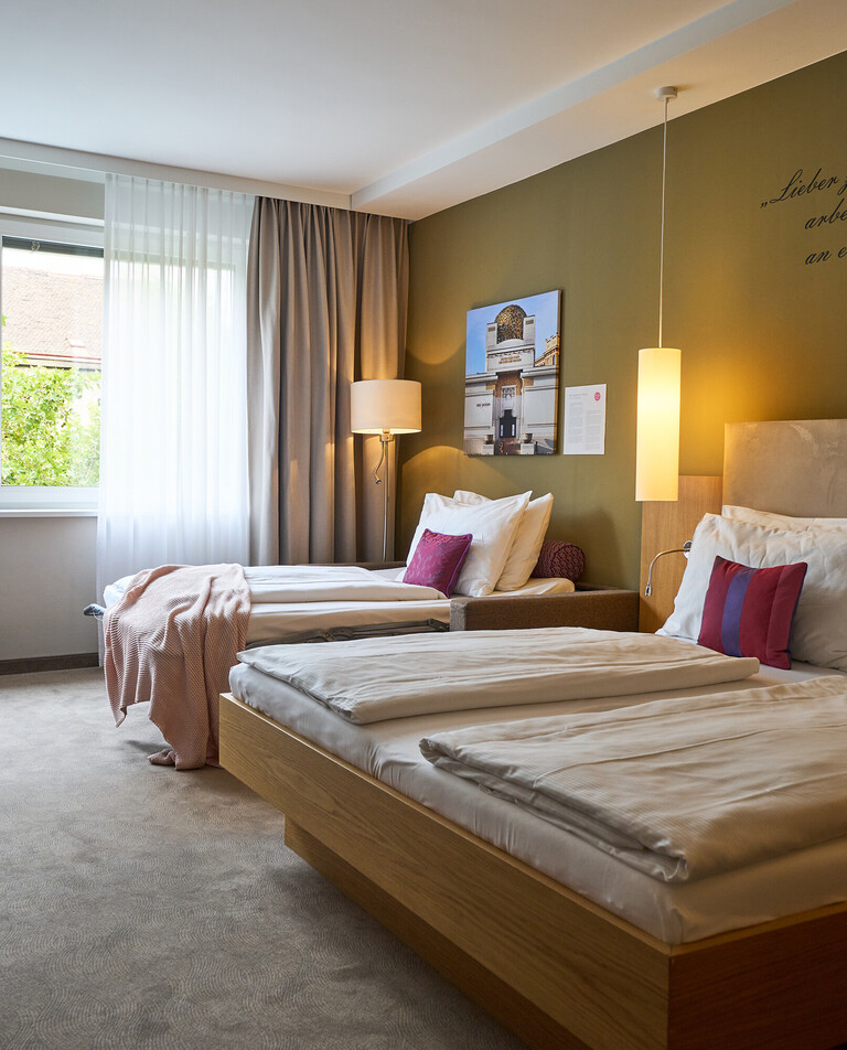 Family room with King Size Bed and sofabed at the Hotel Henriette.