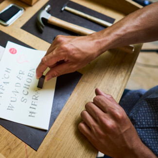 Stamping at the typewriter station in the lobby of the Henriette Stadthotel