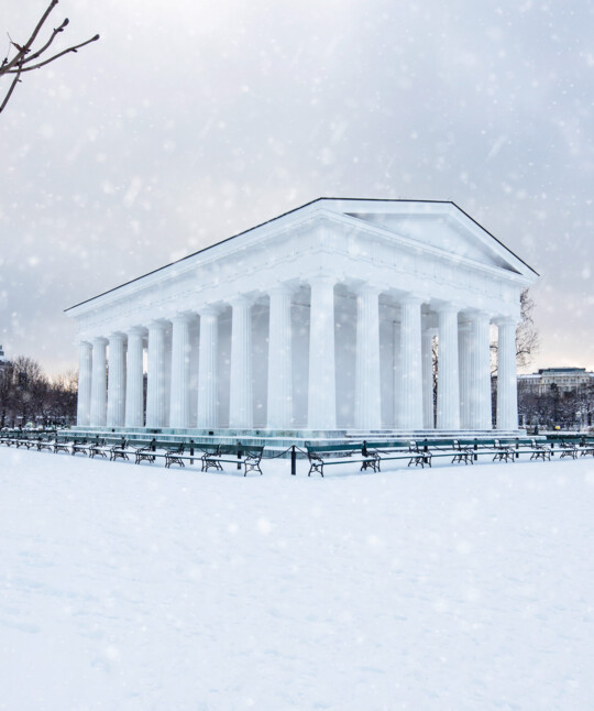 The snow-covered Theseustempel in Vienna's wintry Volksgarten.