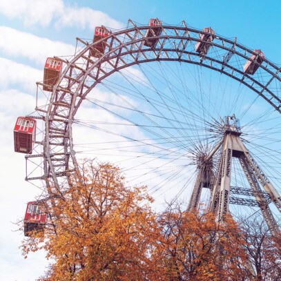 Vienna's Giant Ferris Wheel behind autumn leaves – close to Hotel Henriette in Vienna.