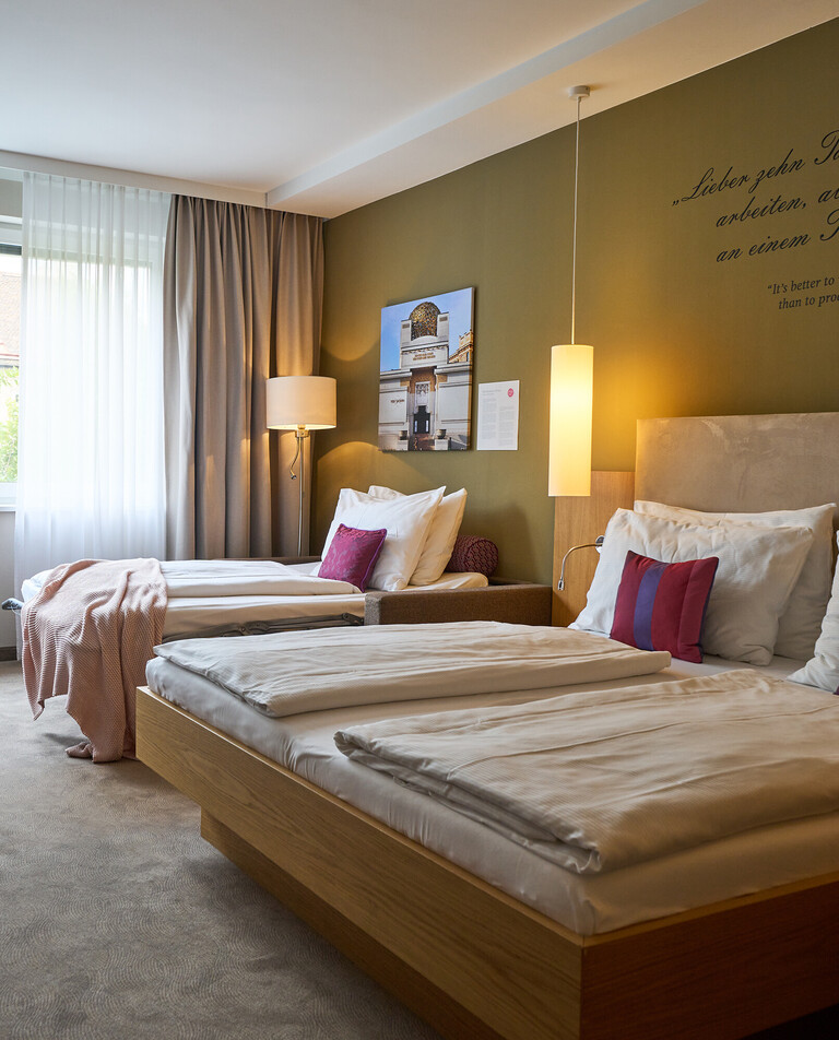 Family room with King Size Bed and sofabed at the Hotel Henriette.
