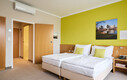 Modernes Doppelzimmer mit Balkon im Henriette Stadthotel in der Wiener Innenstadt.