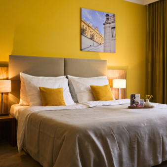 Cosy and colourful Deluxe Double Room at Hotel Henriette in Vienna.