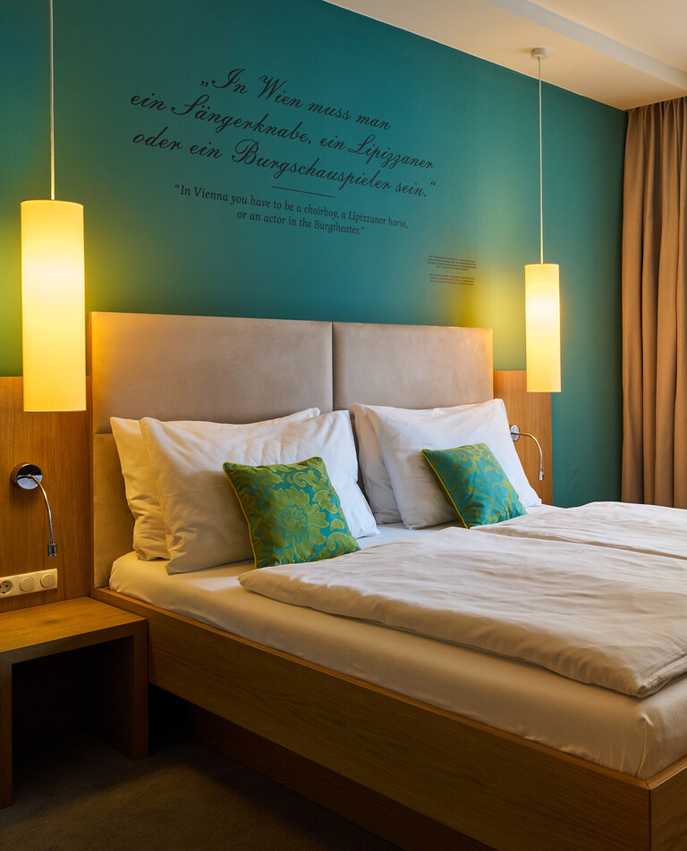 Large double bed in the Hotel Henriette near the Messe Wien Exhibition & Congress Center.