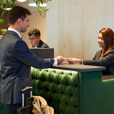 Business travelers checking in at the Henriette Stadthotel near the Messe & Congress CenterWien.