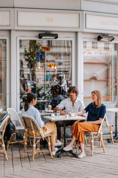 Cosy Viennese coffee house with outdoor seating.