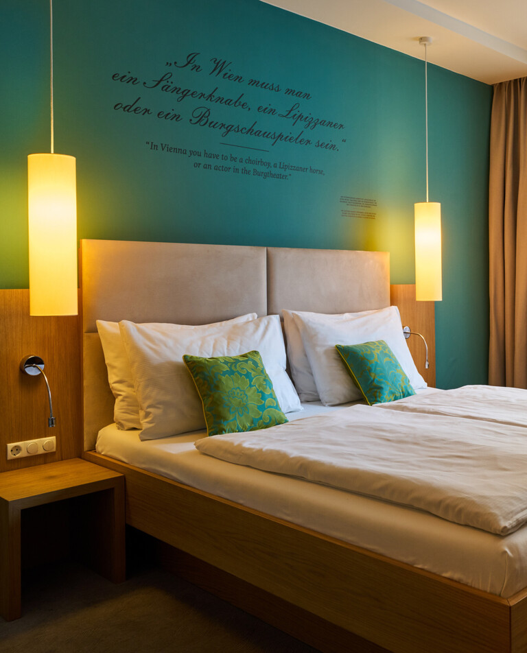 Large double bed in the 4-star Boutique Hotel Henriette in Vienna.