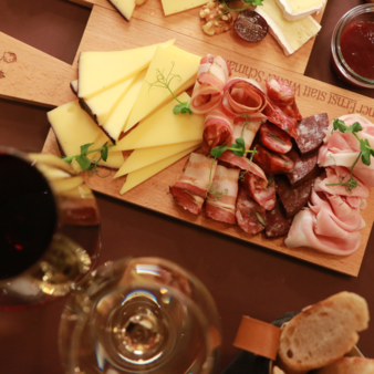 Classic platter at Der schöne Ernst with assorted cheeses, cured meats, bacon, and bread.