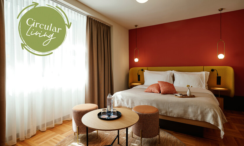 Unique Circular Living room with a double bed and parquet flooring at Stadthotel Henriette in Vienna.